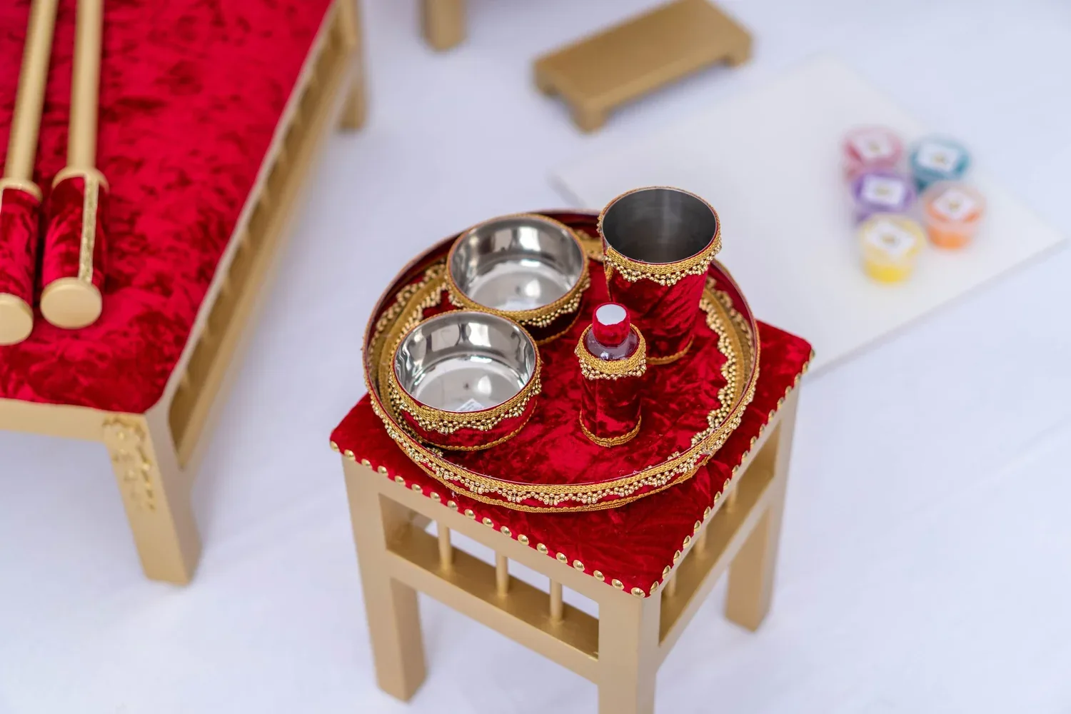 The Royal Crimson tray table seen closer, with the brass Sagan tray, bowls, cup and oil bottle.