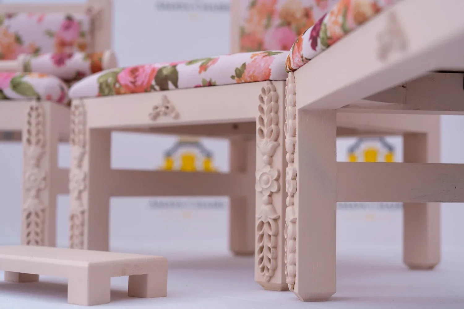 Detail of the carved ivory frames on an Enchantress bench and tray table, with the Phatti beneath.